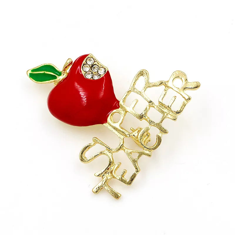 Broche de educación